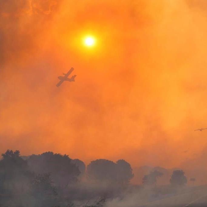 Most vacationers return to their campsites after a wildfire ripped through French tourist area